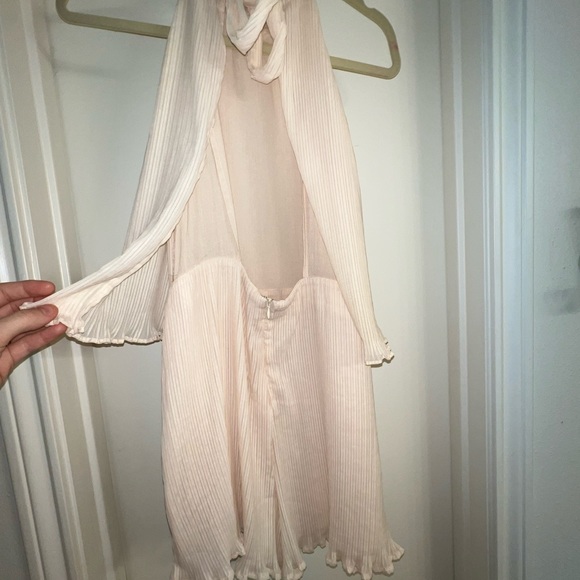 Adorable cream chiffon ruffle short romper with tie back. Open winged back. - Picture 9 of 13
